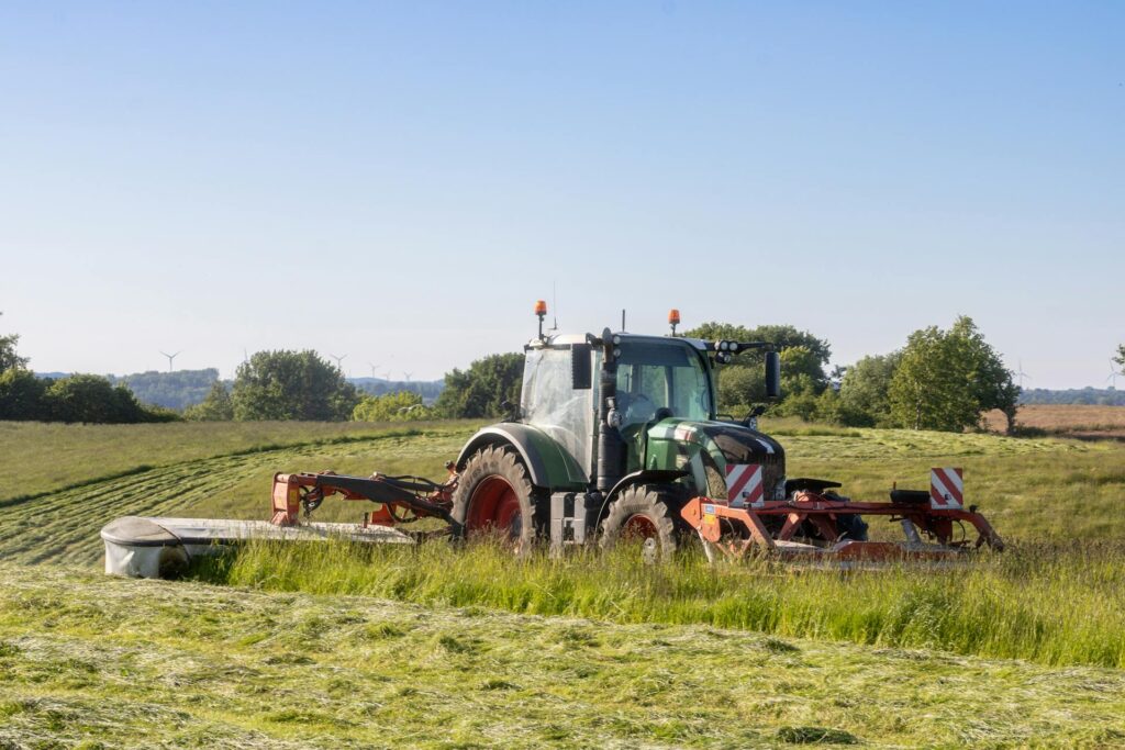 Farm Tractor on the hay field