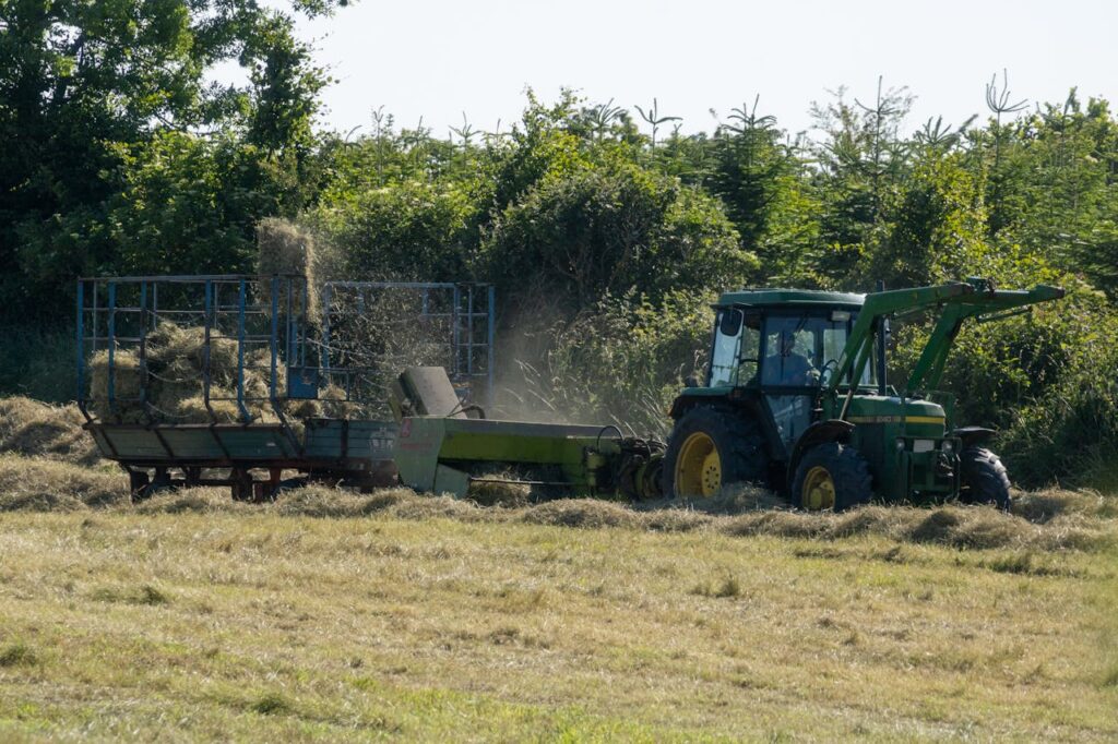 Old John Deere Tractor baling hay