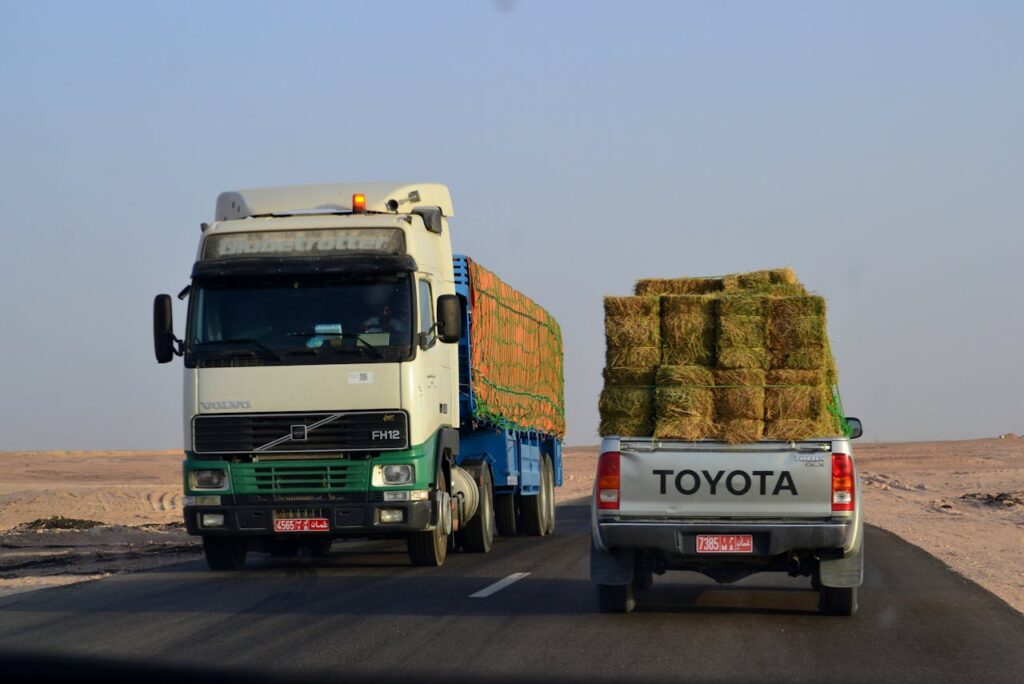 hay bales being transported on a truck